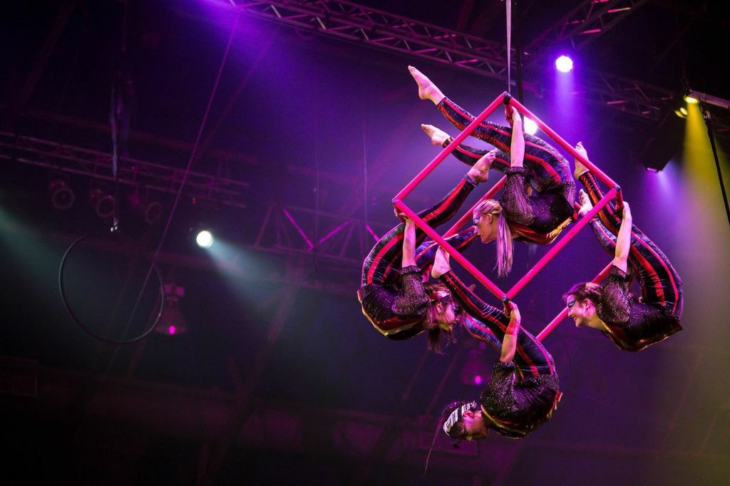 Members of Circus Juventas model the spinning cube. Photo by Dan Norman.